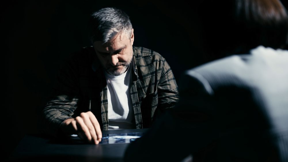 Man being shown evidence during questioning